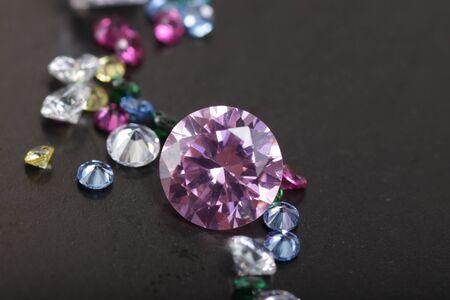 Macro shoots of a group of diamonds that has different shapes, heart, round, pear, asscher, oval, princess, isolated backgroundの写真素材