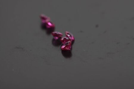 Macro shoots of a group of diamonds that has different shapes, heart, round, pear, asscher, oval, princess, isolated backgroundの写真素材