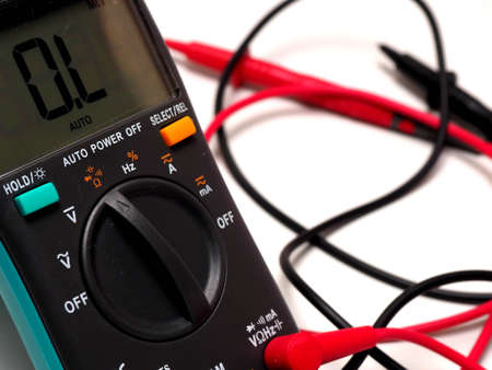 Picture of a digital multimeter, with red and black probe. Shoot on a white isolated backgroundの写真素材