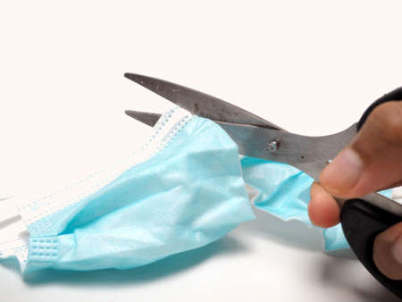 Picture of medical face mask to protect human health from diseae. Shoot on white isolated backgroundの写真素材