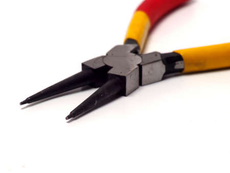 Picture of snap ring plier that has a yellow - red handle. Shoot on white isolated background.の写真素材