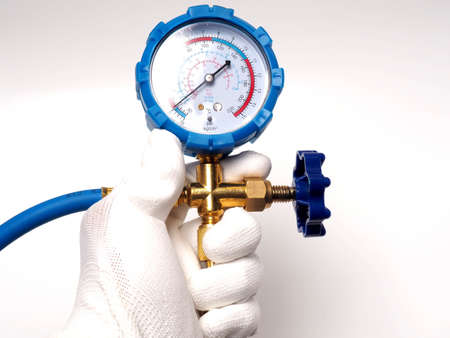 Picture of blue pressure meter, tool that usualy used by technician to measure gas pressure. Captured on a white isolated bachground.の写真素材