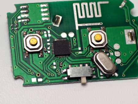 Green Printed Circuit Board (PCB) with some Surface Mount Device (SMD) components and chips. Shoot on white isolated background.の写真素材