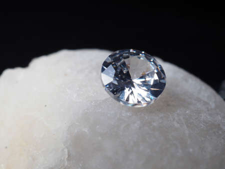 Close up shoot of shiny diamonds. Shoot on a black textured backgroundの写真素材