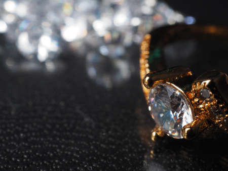 Close up shoot of shiny diamonds. Shoot on a black textured backgroundの写真素材