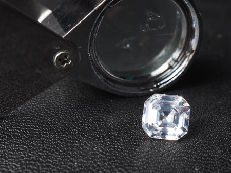 Close up shoot of shiny diamonds. Shoot on a black textured background