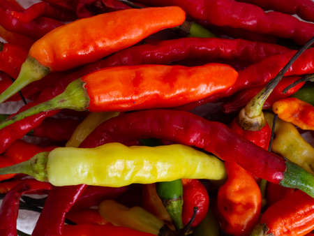 Close up shoot of red hot chillies, captured on a white backgroundの写真素材