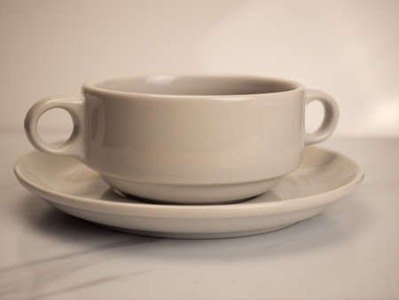 Picture of A white porcelain bowl and plate on a white background
