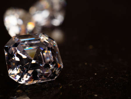 Close up shoot of beautiful sparkling diamonds on a black backgroundの写真素材