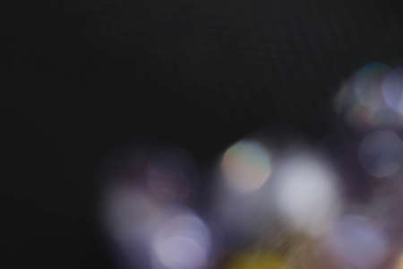 Multi color defocused diamonds blur bokeh abstract backgroundの写真素材