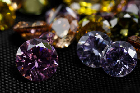 Macro shot of beautiful colored sparkling syntethic diamond that made from glass