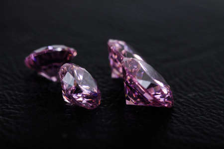 Macro shot of beautiful colored sparkling syntethic diamond that made from glass
