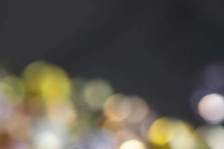 Multi color defocused diamonds blur bokeh abstract backgroundの写真素材