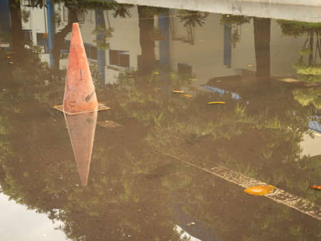 Water puddle formed after hard rain at the parking lotの写真素材