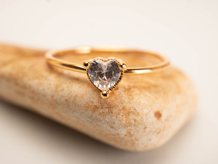 Close up shoot of gold wedding ring with beautiful diamondの写真素材