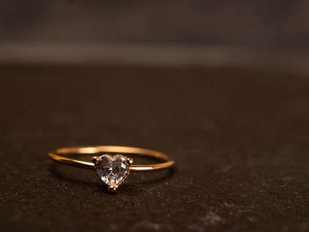 Close up shoot of gold wedding ring with beautiful diamondの写真素材
