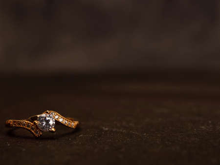 Close up shoot of gold wedding ring with beautiful diamondの写真素材