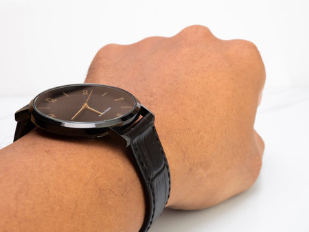 Water resistant black watch with leather strap wear by asian manの写真素材