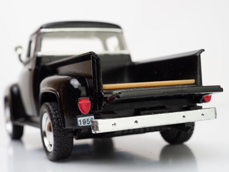 Back view of a black truck miniature toys with open tailgate doorの写真素材