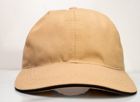 Front view of a brown baseball hat on a white backgroundの写真素材