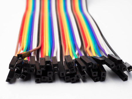 Multi colors cable with black socket on a white isolated background for electronic purpose
