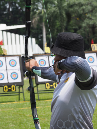 Archer aiming at an archery competition in the field