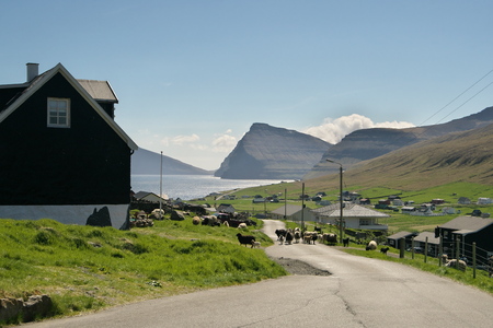 Beautiful landscape view to the ViÃ°areiÃ°i settlement on the ViÃ°oy the northern-most island of the Faroe Islands. Fugloy and SvÃ­noy in the background. Glorious sceneries of the Faroes.の写真素材