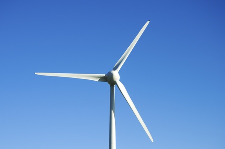 Wind turbine against a blue sky
