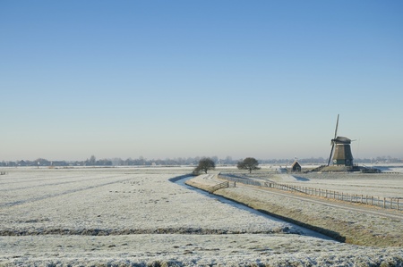 A windmill in a dutch winter landscapeの写真素材