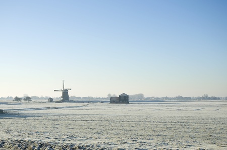 A windmill in a dutch winter landscapeの写真素材