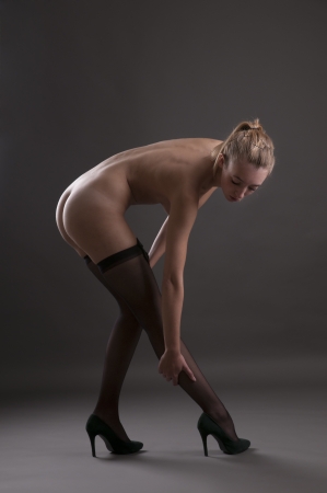 Beautiful woman nude with black stockingsの写真素材