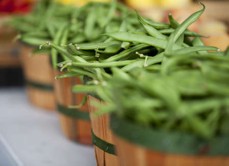Green beans in a basket at Farmers Marketの写真素材