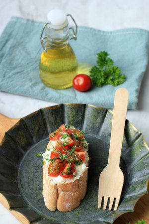 Italian Tomato Bruschette or Bruschetta on Rustic Plate, Homemade Foodの写真素材