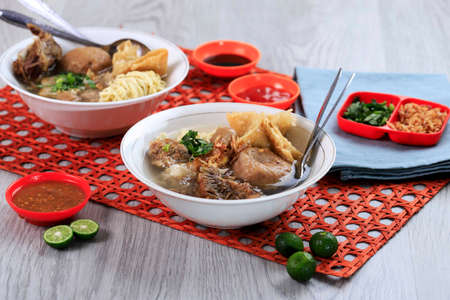 Bakso Malang Komplit, Meatball Soup with Various Side Dish like Noodle, Fried Shiumay, or Ribs.の写真素材