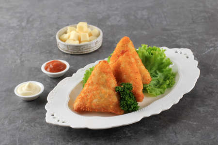 Triangle Fried Risoles or Risol is Indonesian Traditional Street Food made from Flour Skin with...