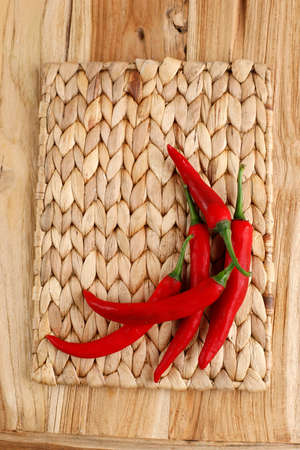 Red Pepper Chilli or Cabe Merah Besar on Wooden Table, Isolated