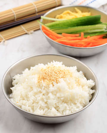 White Rice with Sesame Seed and Fresh Vegetable, preparation Making Korean Rice Roll Kimbap or Gimbapの写真素材
