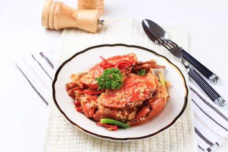Chilli Mud Crab, Crab with Singaporean Sauce, Special Singapore Cuisine. Served on White Plateの写真素材