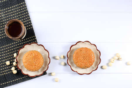 Flat Lay Mid Autumn Festival Mooncake and Tea Still Life on White Textured Background. Copy Spaceの写真素材