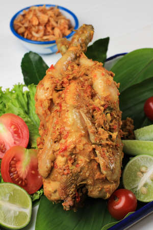 Ayam Betutu. Balinese Roast Chicken Stuffed with Cassava Leaves.の写真素材