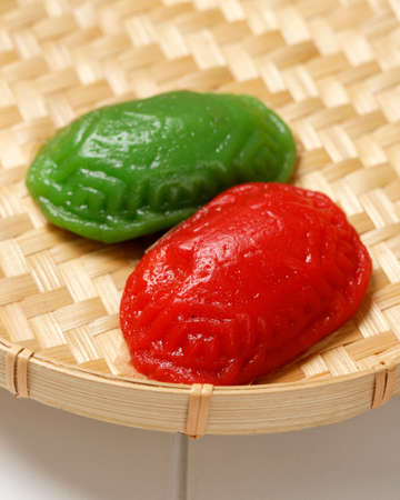 Traditional Famous Dish or Cake New Year of China Known Well as Red Tortoise Cake or Kue Ku or Kuih Tok, on Bamboo Plateの写真素材