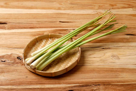 Lemongrass on Bamboo Plate Wooden Table, Copy Spaceの写真素材