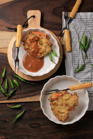 Bala-bala (Ote-ote) is Vegetable Fritters, Popular Street Food in Indonesia. Easy to Make at Home for Break Fasting. Served with Peanut Sauceの写真素材