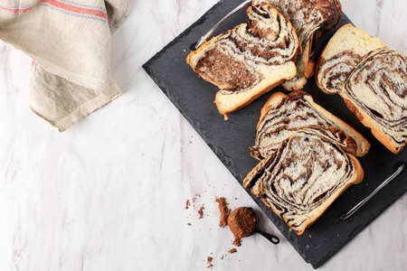 Cinnamon Babka or Brioche Bread. Swirl Bread, Homemade Pastry for Breakfast, White Background, Selected Focusの写真素材