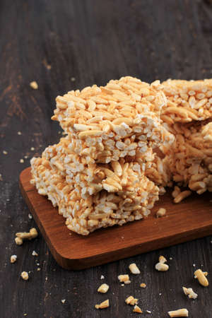 Kue Jipang or Bipang, Javanese Cake Made from Rice Crispy and Sugar, on Wooden Tableの写真素材