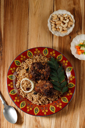 Delicious Asian Pilaf with Spiced Beef Lamb Ribs on a Red Moroccan Plate. Vertical View from Above, Rustic Styleの写真素材