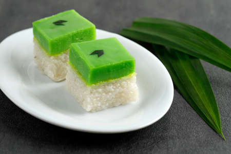 Talam Ketan or Kuih Seri Muka,  Two Layered Dessert with Steamed Glutinous Rice at the Bottom and Green Custard Layer Cake on Top.の写真素材