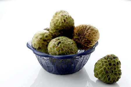 Custard Apple on Basket, Isolated on White. Known as Sugar Apple Too