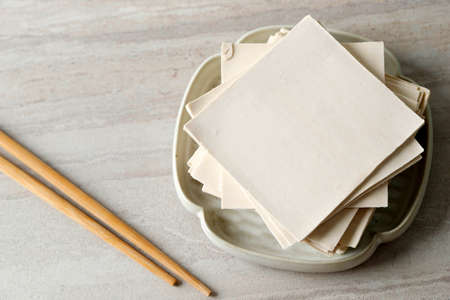 Kulit Pangsit (Wonton Wrappers) or Dumpling Skin, usually as a wrapper with minced meat in it. This food is usually an additional menu when ordering the boiled noodle menu, sometimes also as a snack.の写真素材