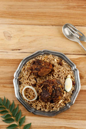 Nasi Kebuli Iga Kambing, Spice Arabian Rice with Clove, Cinnamon, and Garlic. Kabli Rice with Lamb Meat, Served for Ramadan Iftarの写真素材